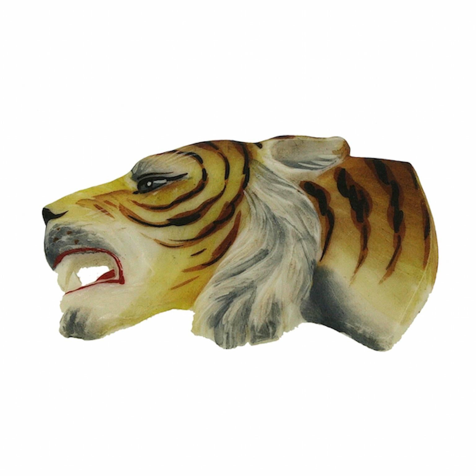 Featuring a vibrant and evocative design, this wonderful brooch dates from the 1930s.
Condition Report:
Excellent
The Details...
This brooch is constructed from celluloid and is hand painted and carved to resemble a tiger. The brooch fastens with a