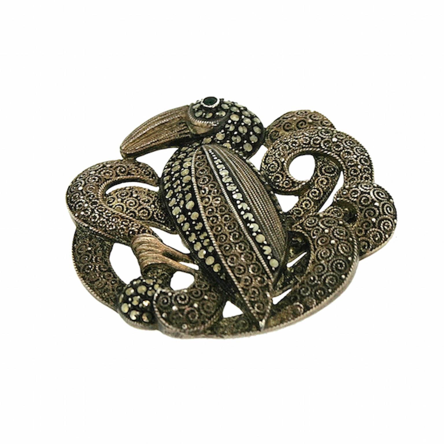 This brooch is a beautiful and whimsical example of the 1930s marcasite work of the German Theodor Fahrner company. 
Condition Report:
Excellent
The Details...
This brooch is silver. It features a stylised bird motif set with marcasite and a green