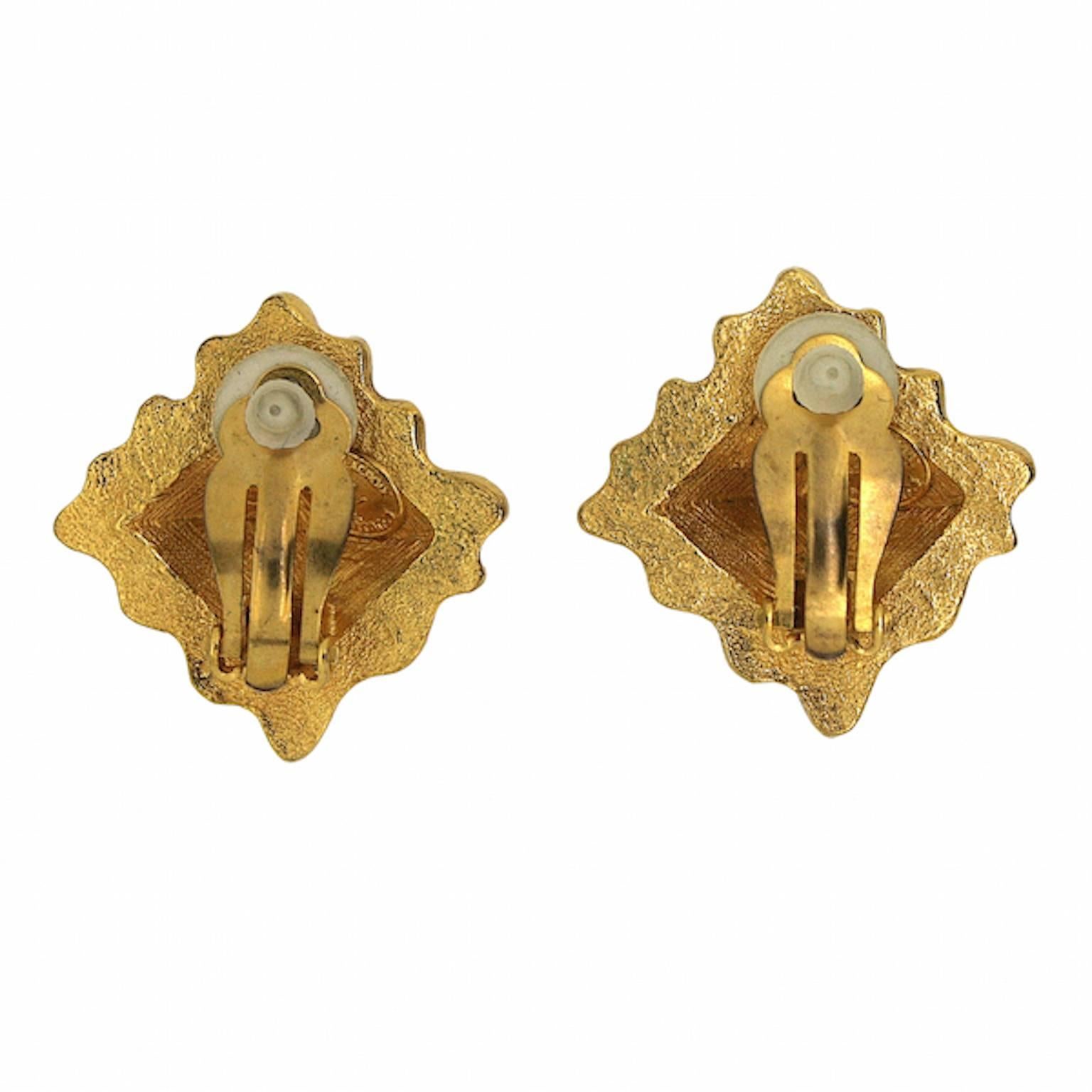 These show-stopping earrings by French designer Christian Lacroix were made in the 1990s. They are clip on. 
Condition Report:
Excellent
The Details...
These earrings are a matt gold tone metal. They are a diamond shape with a ruffled edge and a