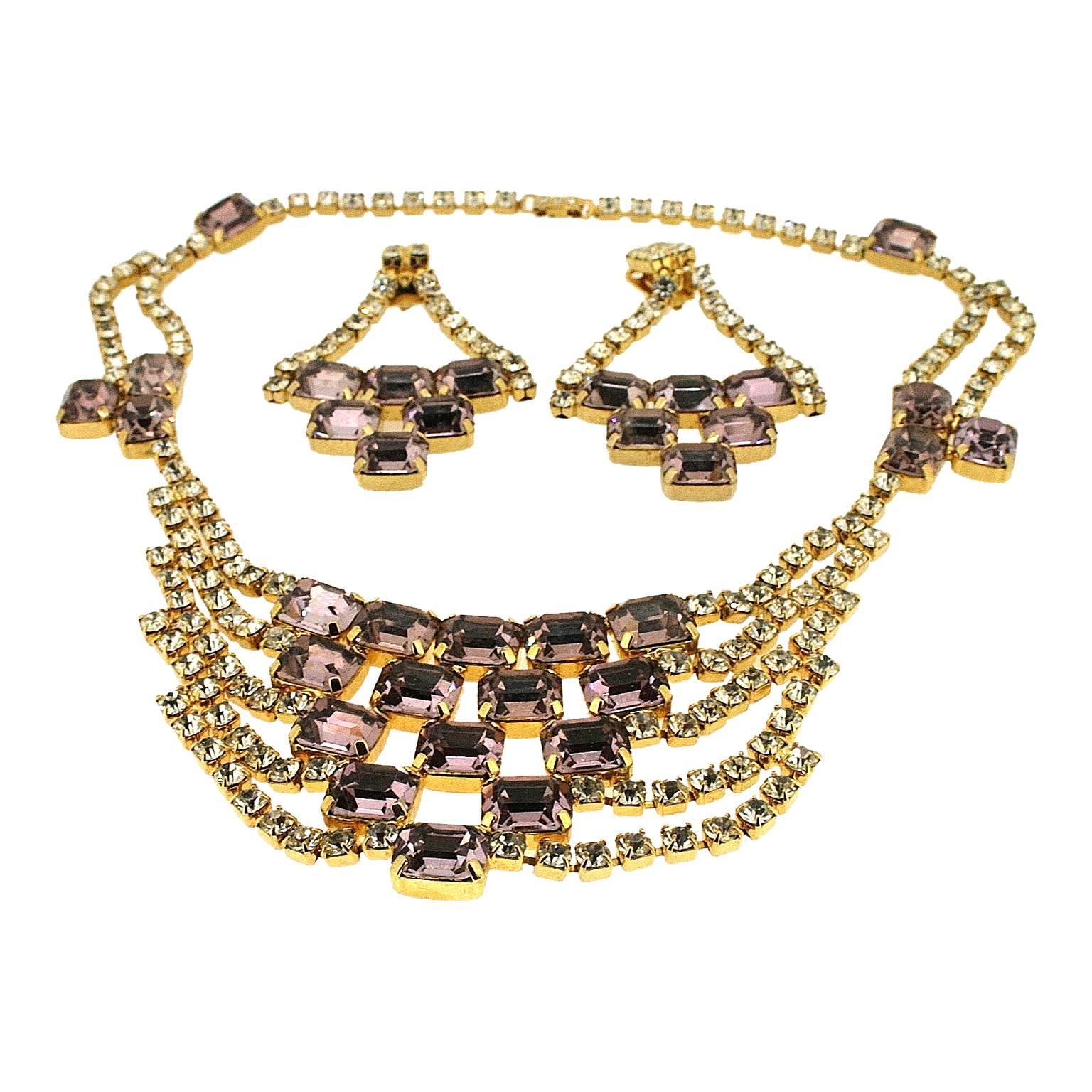 This wonderful example of 1960s cocktail jewellery is an unsigned, high quality necklace and earrings set. 
Condition Report:
Excellent
The Details...
This jewellery set includes a necklace and earrings. Both pieces feature large, emerald cut, lilac