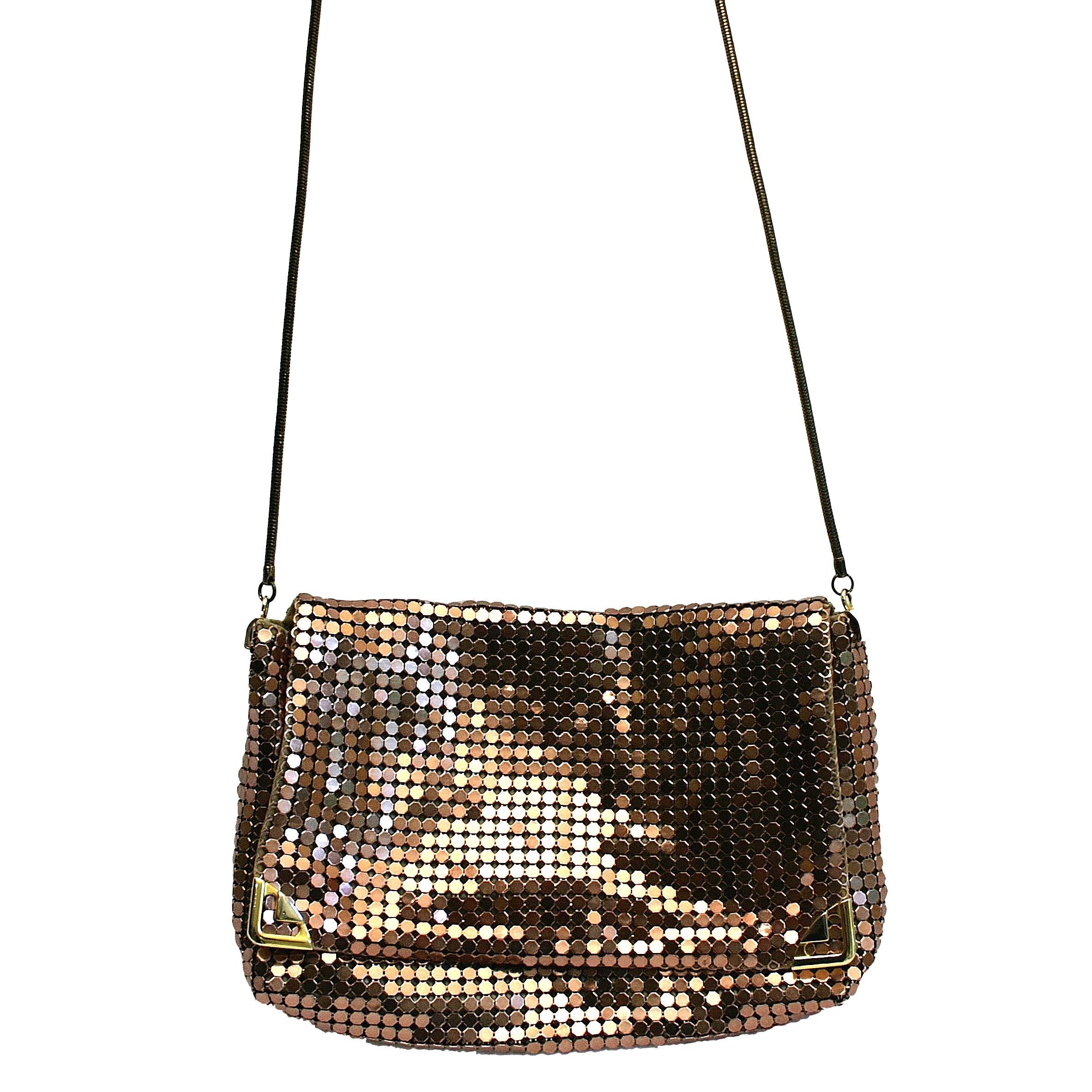 This wonderful and bright handbag was created in Australia by the Glomesh company in the 1970s. 
Condition Report:
Excellent
The Details...
This slouchy style handbag is covered in a rose gold chainmail mesh. It is detailed on the front flap in two