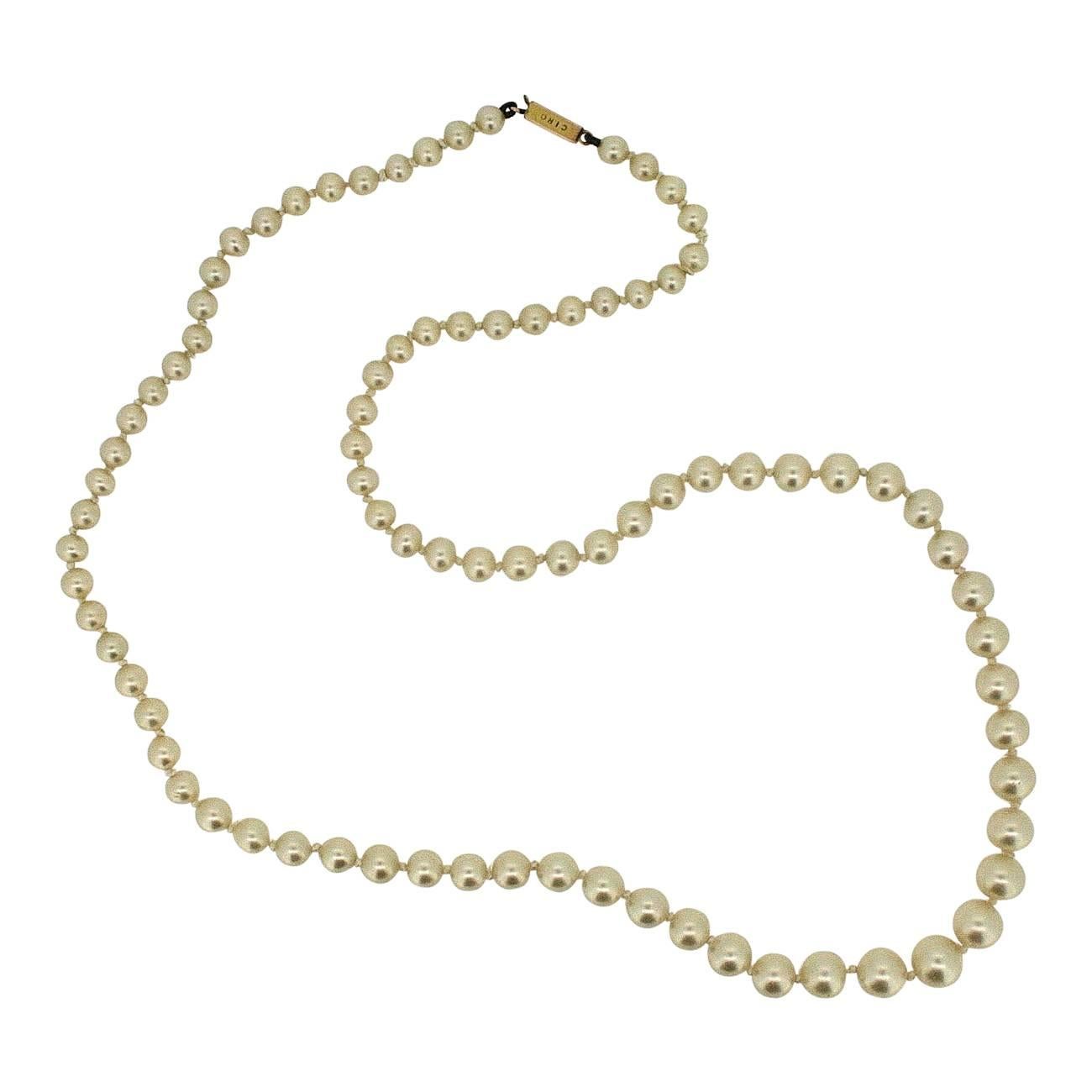 Beautiful and classic, this faux pearl necklace dates from the 1950s. It was created by Ciro - the ultimate maker of cultured pearls. 
Condition Report:
Excellent
The Details...
This necklace features a single strands of hand-knotted cultured pearls