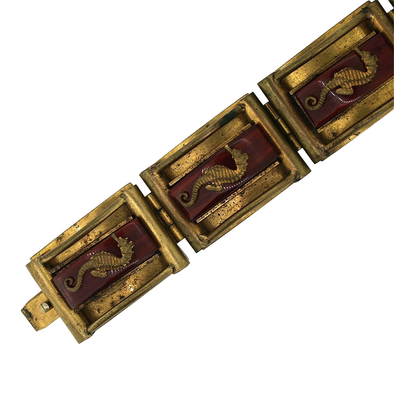 Featuring an unusual and evocative design, this bracelet dates from the 1930s and was created in France by Jean Painlevé.
Condition Report:
Good - Some spotting to the gilt metal and a tiny area of oxidisation on the side of one panel. This is only