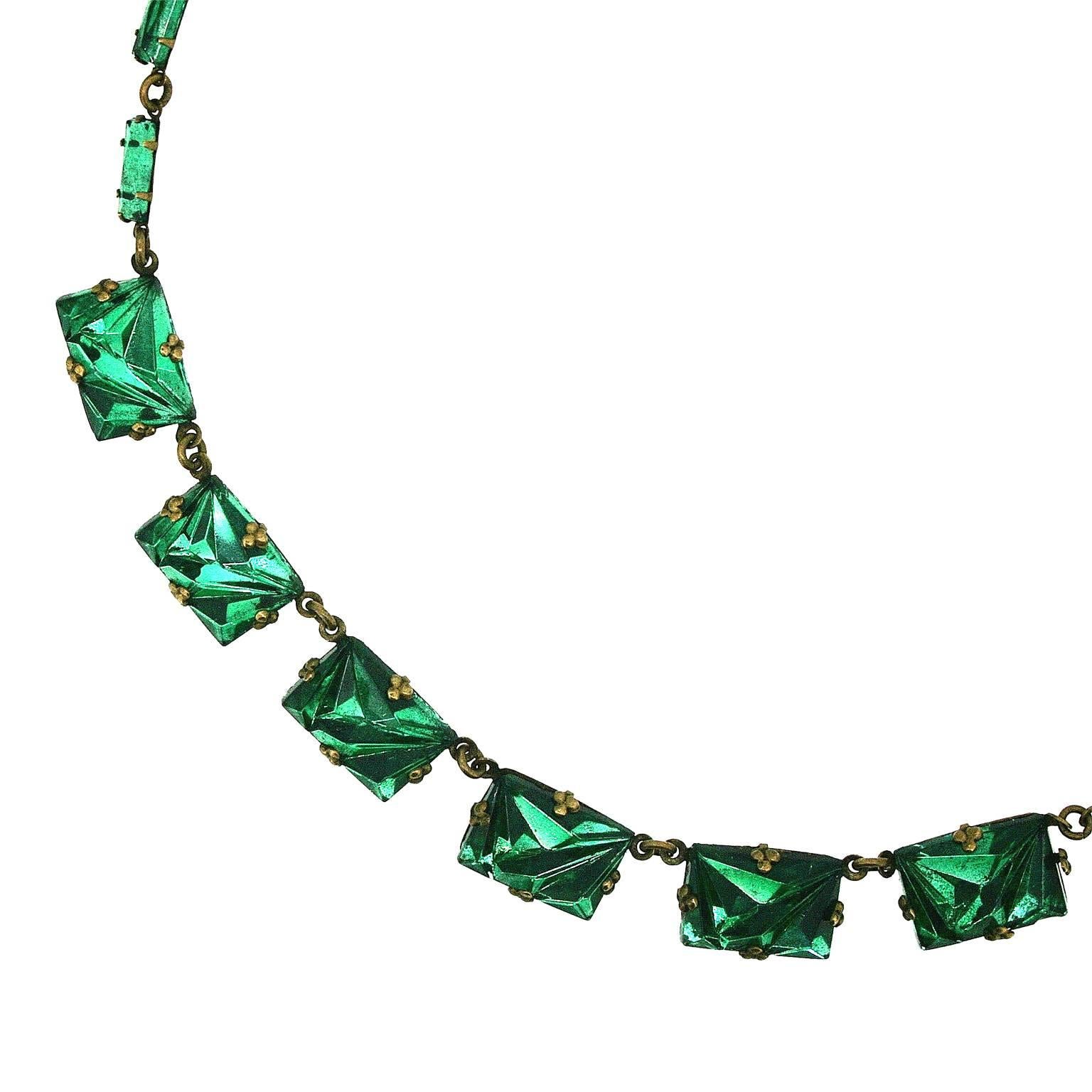 Shimmering and delicate, this necklace dates from the 1920s and was made in Czechoslovakia. It features typically Art Deco and collectible mirror glass. 
Condition Report:
Very Good - the foils on a couple of panels have a little bit of speckling,