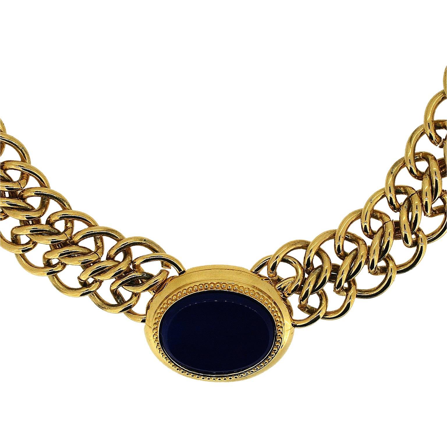 This lovely example of 1980s gold tone styling is by Monet - a classic design from a classic costume jewellery designer. 
Condition Report:
Excellent
The Details...
This gold plated necklace features a double curb link chain at the centre of which