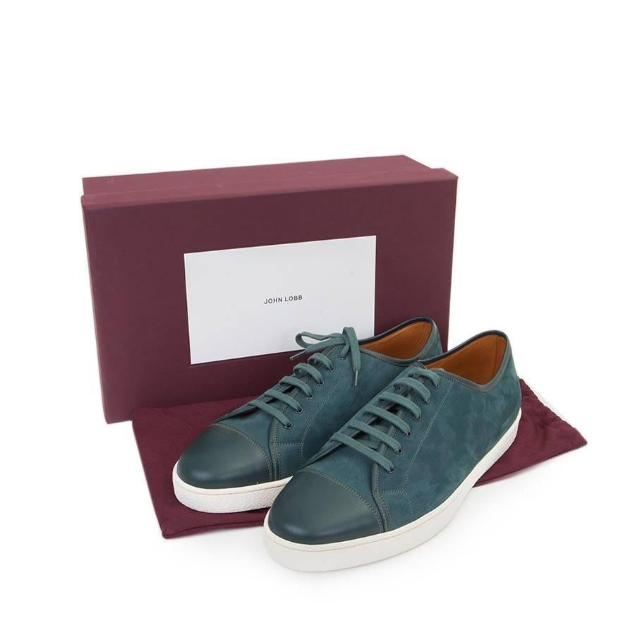 Exceptional John Lobb sneakers model Levah in velvet calfskin and new blue oil leather.
Size 45 FR. 10.5 UK. White textured rubber outsole with yellow stitching.
Length of the insole: 29 cm. Height of the sole: 2.5 cm

Mint condition (s): from