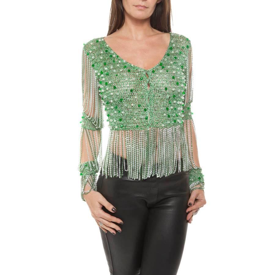 Vintage. Ultra glamorous top of Maison Monsieur Loris Azzaro in green lurex crochet and silver embroidered with green faceted beads, translucent and pearly pearls.

Size 38 (lack of size label).

The sleeves are also fringed with light green and