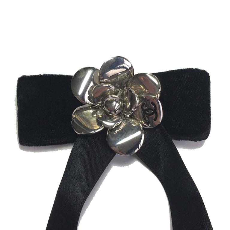 CHANEL Bow Brooch in Black Silk Satin and Camellia in Silver Plated Metal