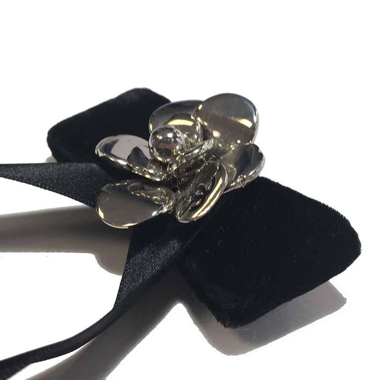 CHANEL Bow Brooch in Black Silk Satin and Camellia in Silver Plated Metal