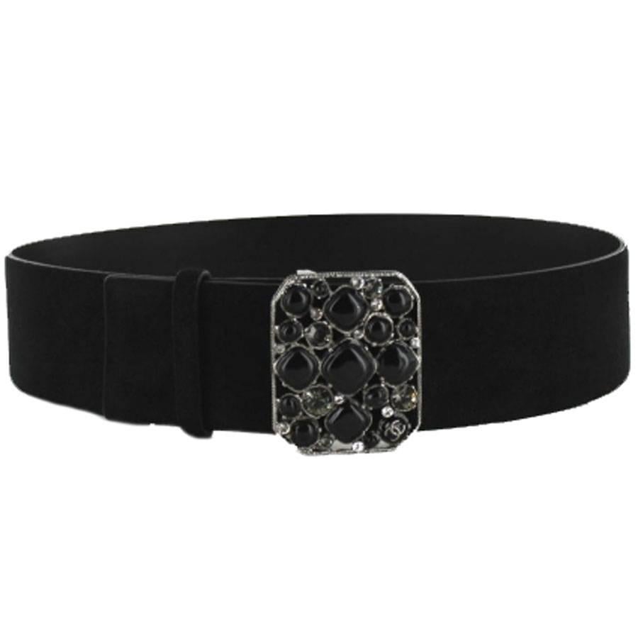 CHANEL belt in black velvet calfskin and buckle in black and silver glass paste. Fall-Winter Collection 2008. 
Buckle in silver metal, pale green and silver rhinestones, and black glass paste. Silver metallic signature on the buckle. 
A small gray