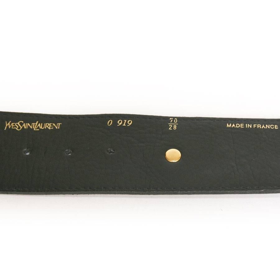 Yves Saint Laurent studded belt in black leather. 

It is worn at the waist. 

Delivered in a Valois Vintage Paris Dustbag