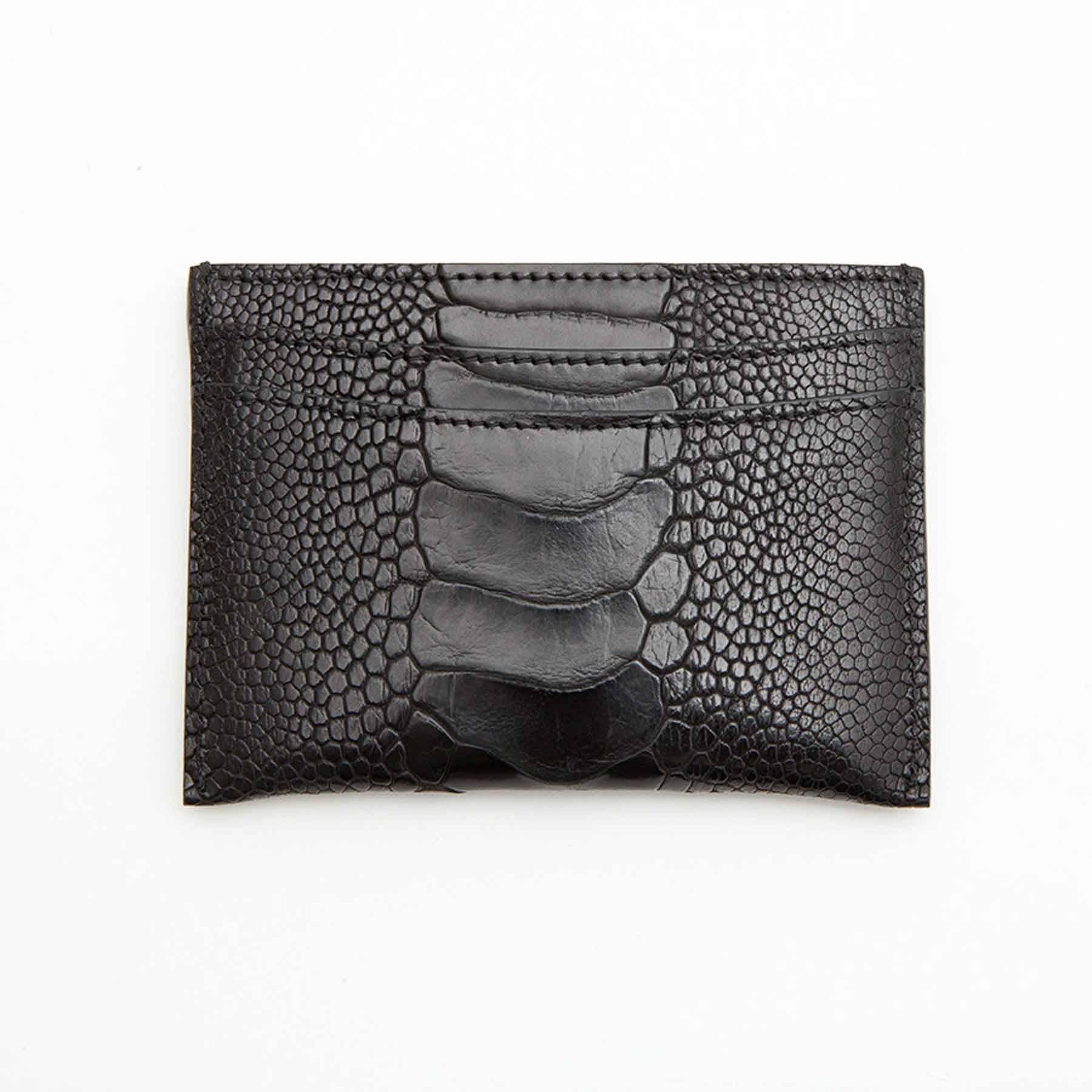Chanel card holder in black ostrich leather. It has a 