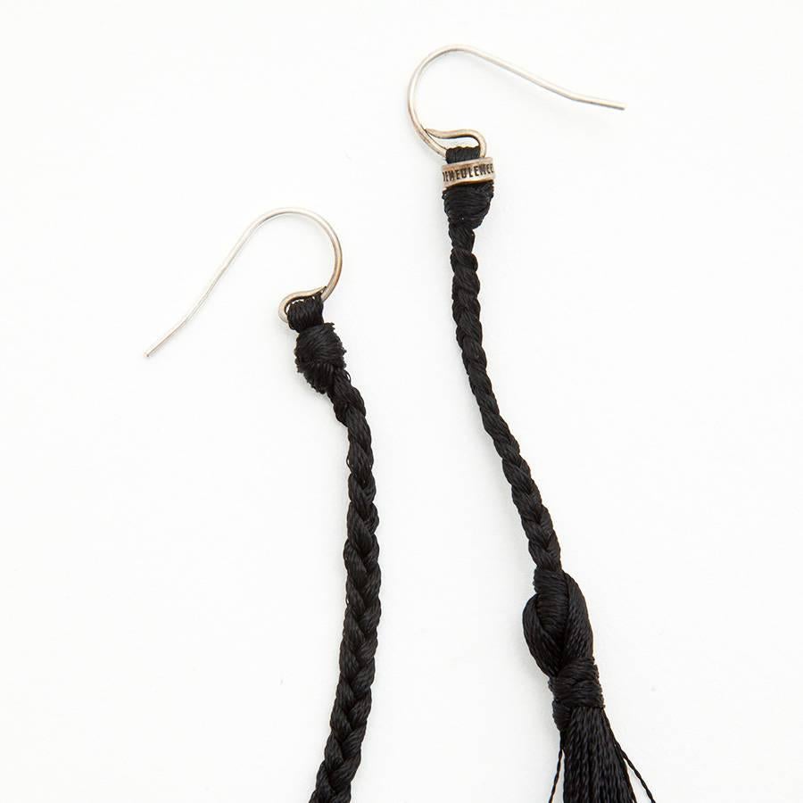 Fine Ann Demeulemeester stud pendants earrings in black thread.

Delivered in their box Ann Demeulemeester