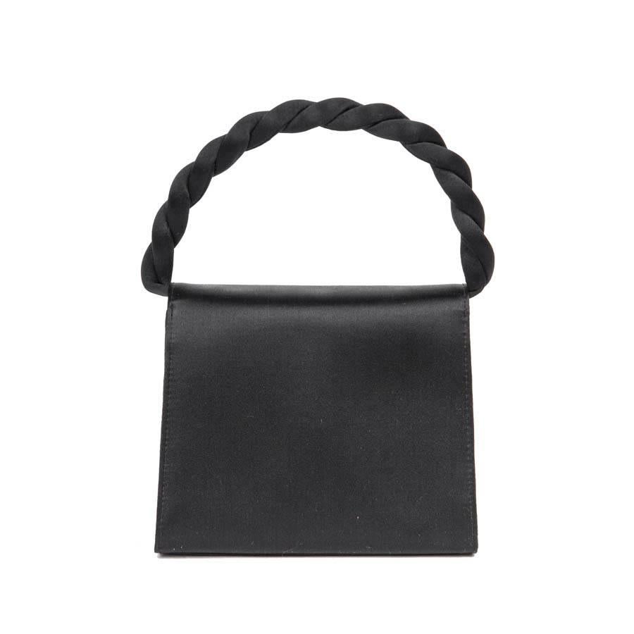Women's Mini CHANEL Couture Flap Bag in Black Silk Satin.