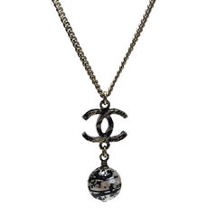 CHANEL Pendant Necklace in Gilded Metal and Pearl with Graffiti Effect