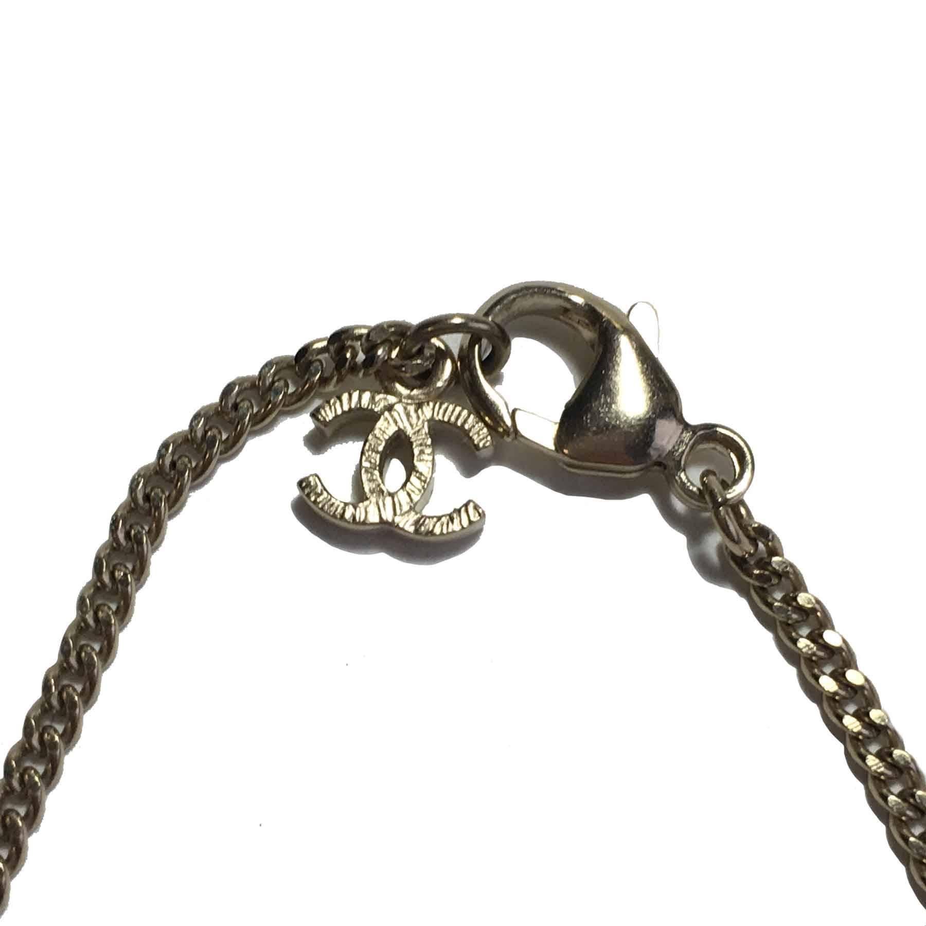 CHANEL Pendant Necklace in Gilded Metal and Pearl with Graffiti Effect 2