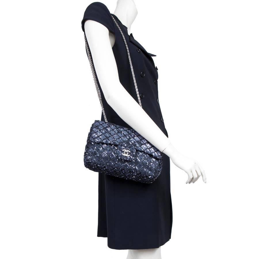 Limited series. Chanel timeless bag with sequins blue night. New condition. The flap is lined with black leather and the inside is lined with black satin. 
There is a zipped pocket. 
The hardware is made of palladium-ruthenium metal.

Ideal for a