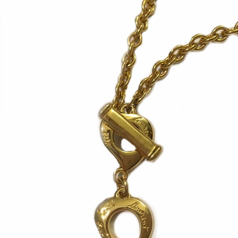 YVES SAINT LAURENT Heart Pendant Necklace in Gilded Metal and
