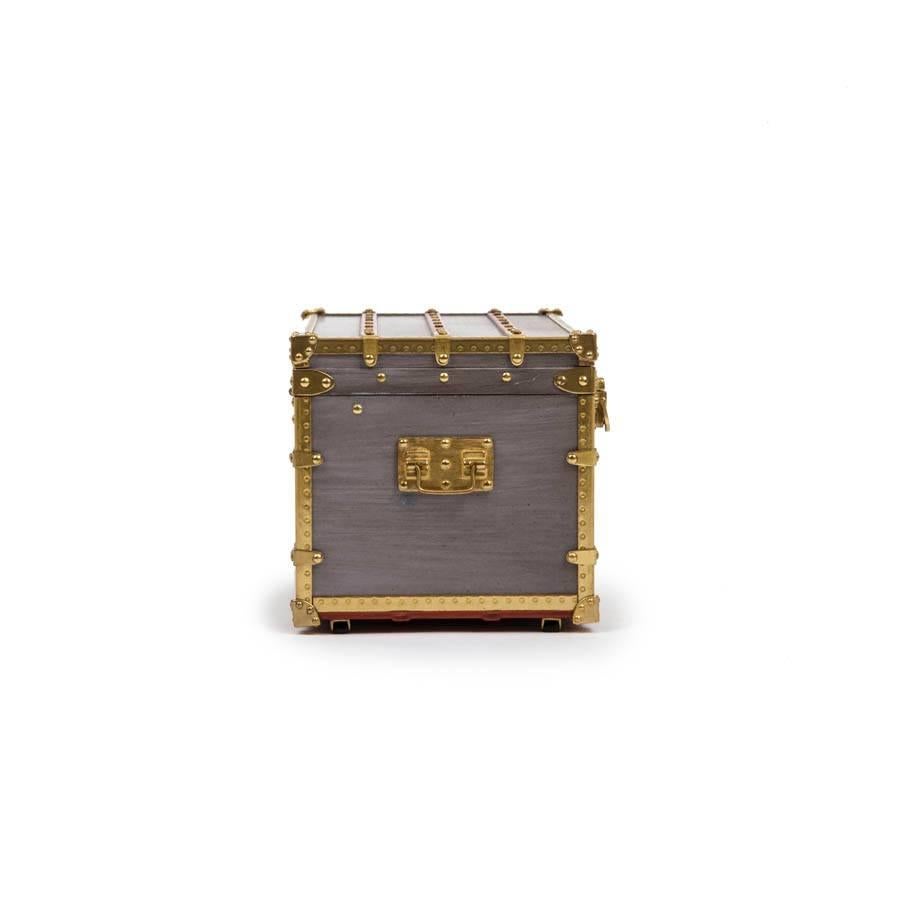 Rare ! Louis Vuitton miniature case. Mini trunk in gray zing, wood and gold metal. It is hermetic. 
This trunk is the perfect reproduction of a model of 1899. It has all the details identical to the trunks of normal size. It was offered to VIPs and