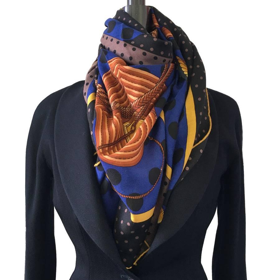 Beautiful shawl Hermes "Clic Clac à pois" in black, indigo, glossy brown cashmere and silk.

Stamp S from private sales

Designed by: Julia Abadie

Delivered in a Valois Vintage Paris Pouch