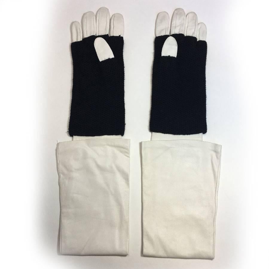 Beautiful Chanel long gloves in white leather and black cashmere. Chanel black leather brief is sewn on cashmere. Beige silk lining.

Size 7.5. 

Dimensions flat: hand width: 10 cm

Delivered in their CHANEL box.