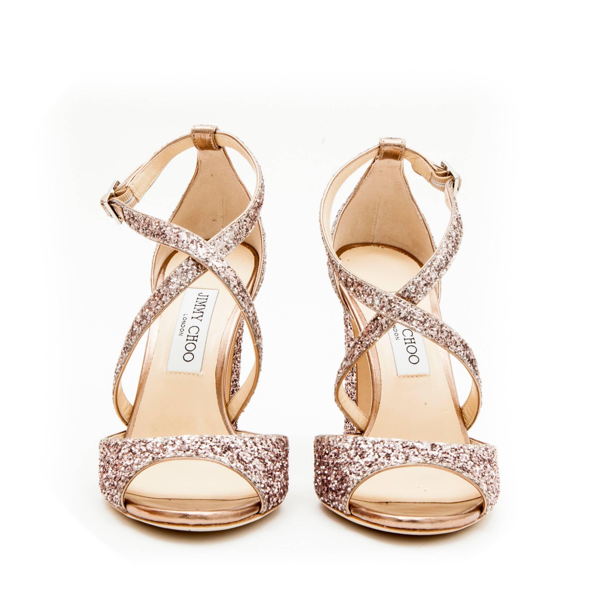 Jimmy Choo pink sequined high heel sandals.

Dimensions:  length of the insole: 26 cm.

 Made in Italy.

Will be delivered in a Jimmy Choo dustbag 
