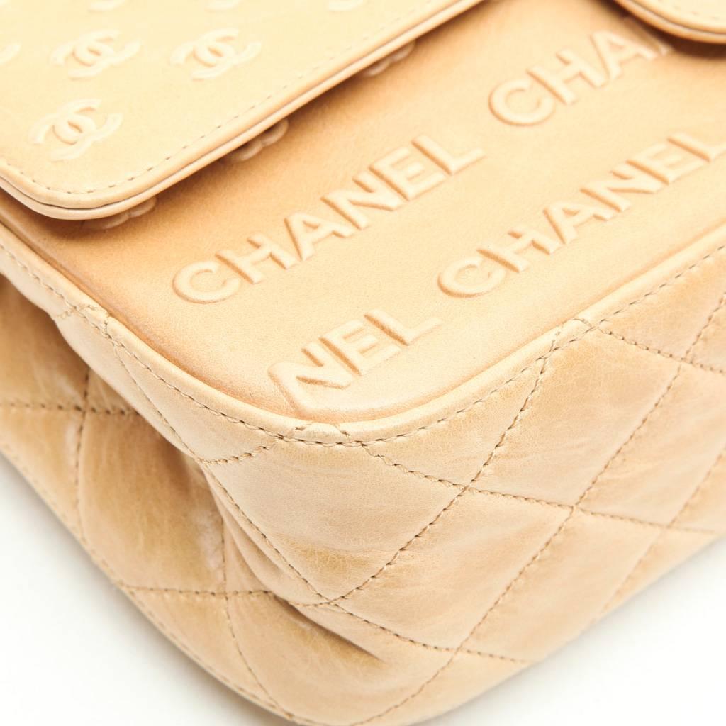 CHANEL 'Timeless' Flap Bag in Beige Embossed 'CHANEL' and 'CC' Lambskin Leather In Excellent Condition In Paris, FR