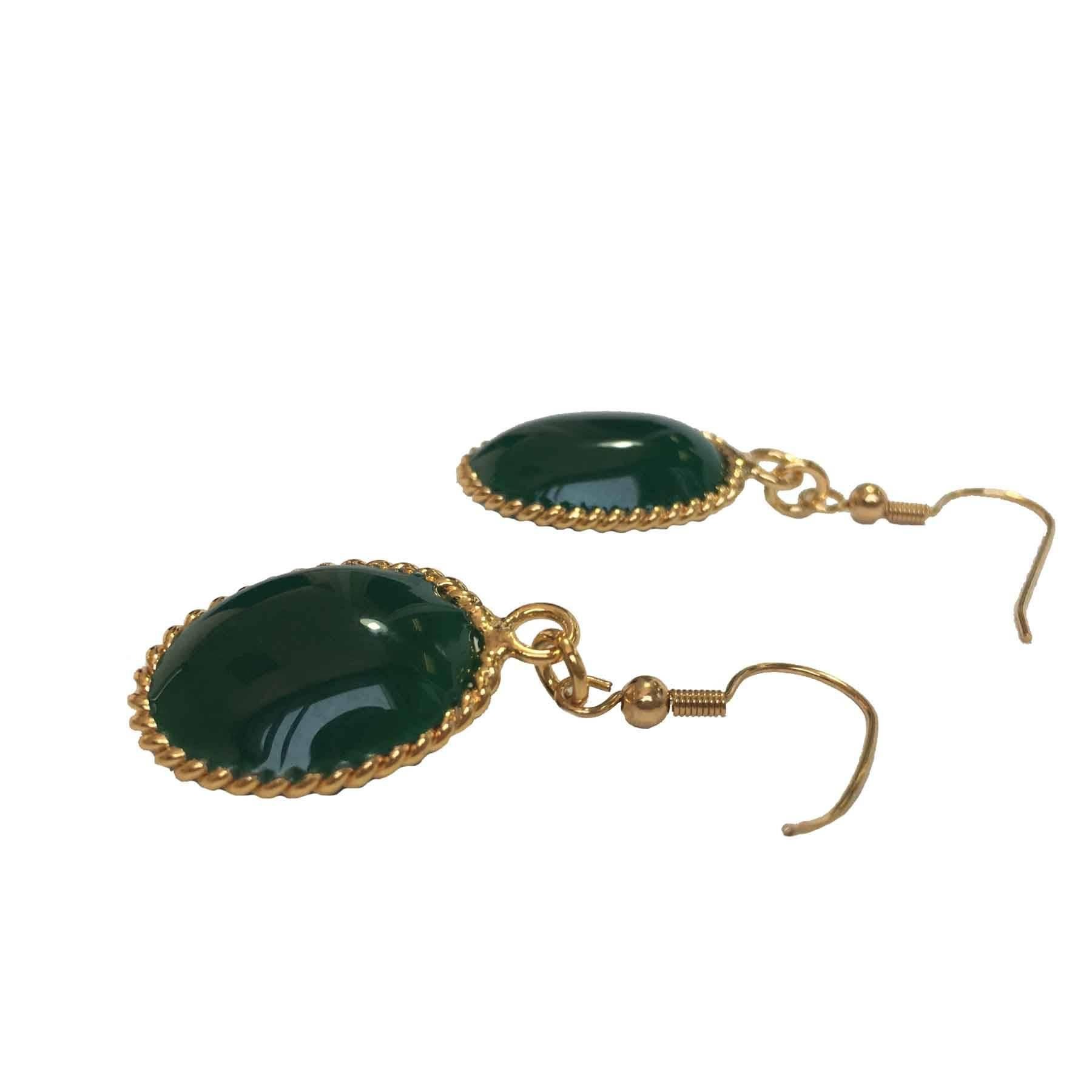 MARGUERITE DE VALOIS stud earrings in dark green molten glass and gilded metal in fine gold. 

Marguerite de Valois manufactures its jewelry in its Parisian workshops. It uses an ancestral technique for the creation of her pieces, the work of the