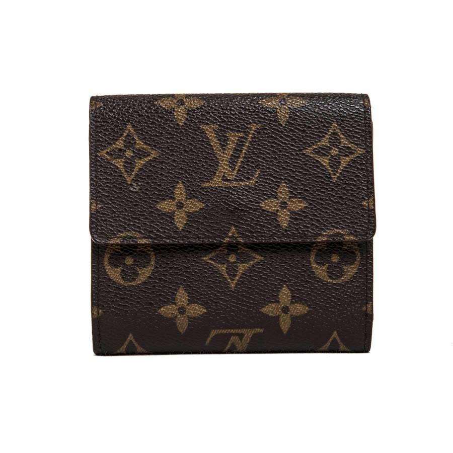 Louis Vuitton wallet in brown monogram coated canvas. There is one side for cards and bills and one side for coins. Each side closes with a snap, an apparent engraved Louis Vuitton and one invisible.

The interior is in brown leather.

This wallet