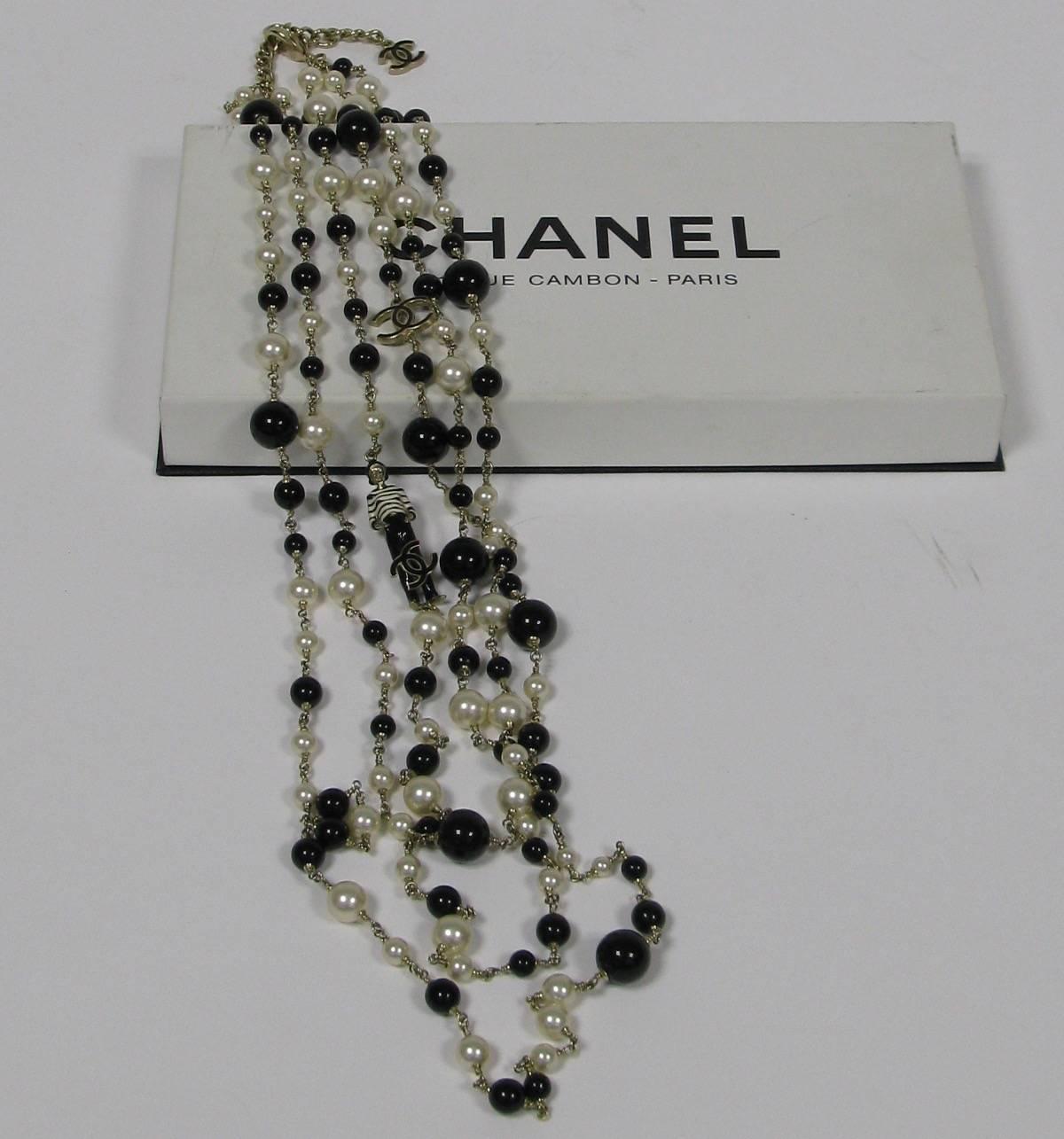 CHANEL Multi-Row Necklace in Black and White Pearls, CC and Coco Figurine 1