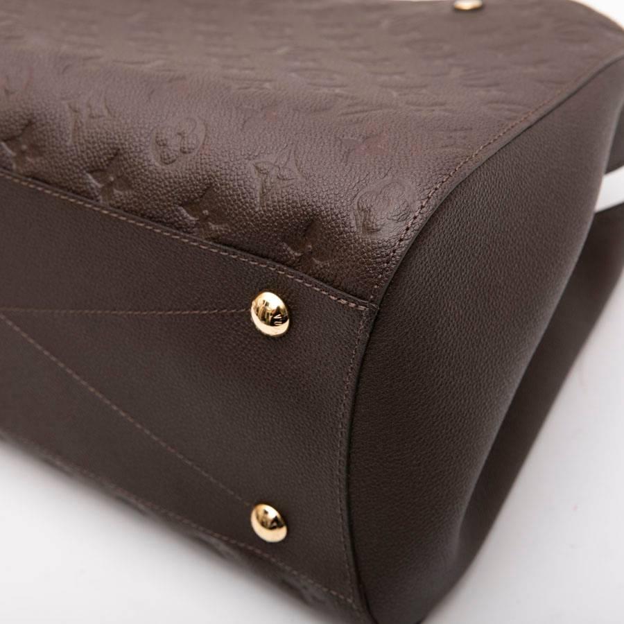 LOUIS VUITTON 'Montaigne GM' Bag in Monogram Empreinte Earth-Tone Leather In New Condition In Paris, FR