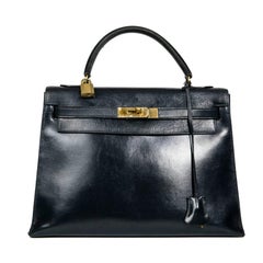 HERMES Sac Vintage Kelly 32 en cuir bleu marine avec boîte