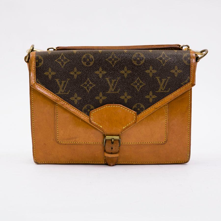 Louis Vuitton vintage satchel bag in brown Monogram canvas and natural cow leather. Golden metal hardware. 

Bellows on each side. 

Worn on the shoulder or crossover with a handle and removable shoulder strap

Made in France

Good used condition