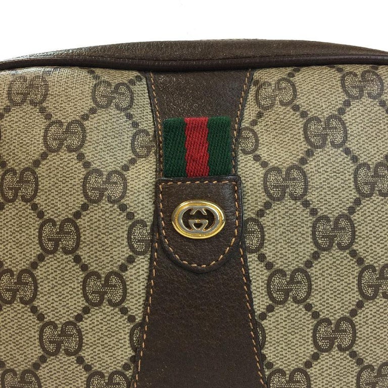 GUCCI Clutch Bag in Beige Monogram Coated Canvas and Brown Leather For