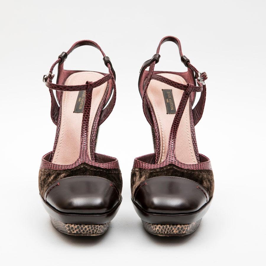 Louis Vuitton high heels sandals in burgundy leather, brown velvet and burgundy lizard. The strap is in burgundy python. The heel and platform are in wood covered with brown and beige lizard. 
Outsoles in genuine leather. 

Made in Italy. Very good