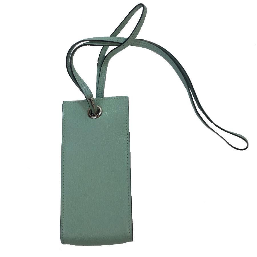 Hermès mini clutch in blue celadon leather.

Worn on the shoulder or by hand. Length of the handle: 62 cm

Stamp S from private sales, made in France.

Dimensions: length: 6.5 cm, height: 14 cm, depth: 2.5 cm

Will be delivered in its HERMES Dust bag