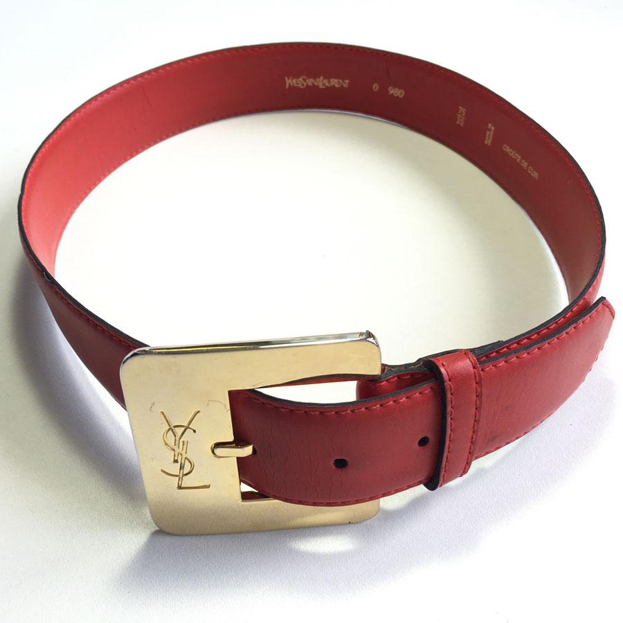 YSL YVES SAINT LAURENT belt in red leather and gilt metal clasp. 

The initials are engraved on the loop. Size 75/30. Made in France.

This belt is in good condition. The red leather is cracked on the inside (see photo), small spots on the front of