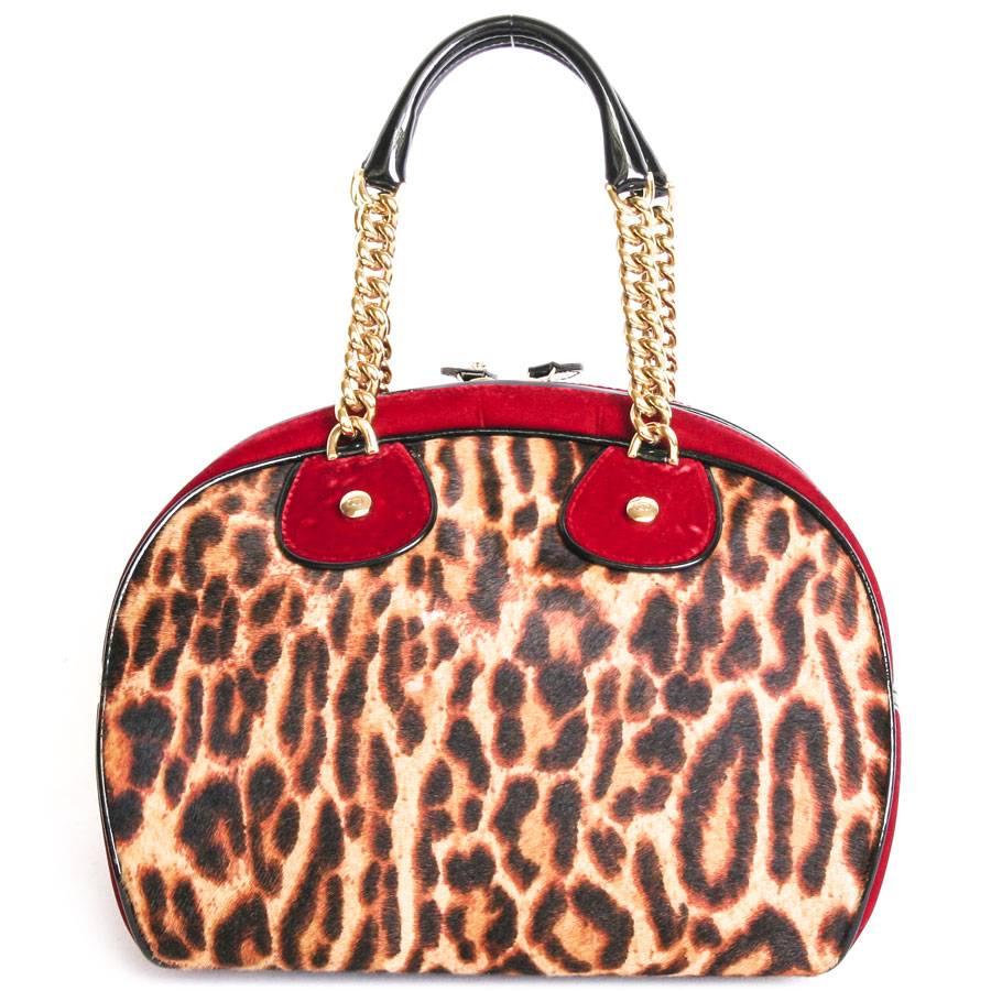 Christian Dior bag in leopard-colored foal and red velvet on the side. Limited edition. 
The outer bottom is in black patent leather.
Gilt metal hardware.  
The interior is in black monogram canvas with 2 pockets including one zipped.

Delivered in