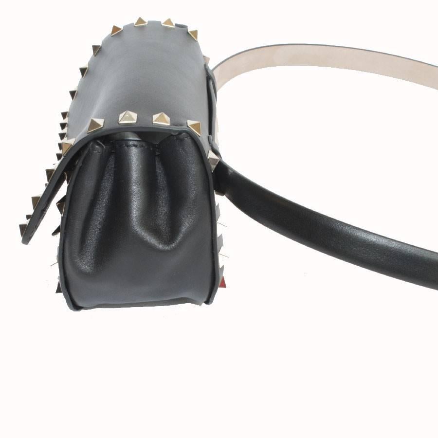 VALENTINO  Rockstud Line Clutch in Black Leather and Gilded Studs 1