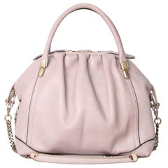 Bolso de piel rosa empolvado "La Rue" de Nina Ricci