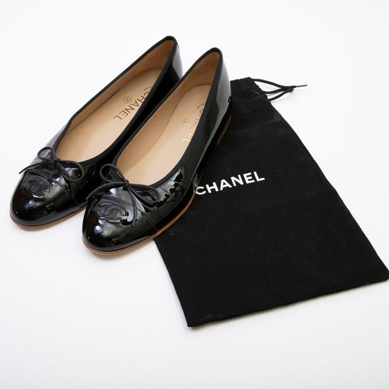 black patent ballerinas