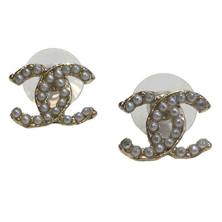 CHANEL CC Stud Earrings in Gilt Metal set with Pearl Beads. at