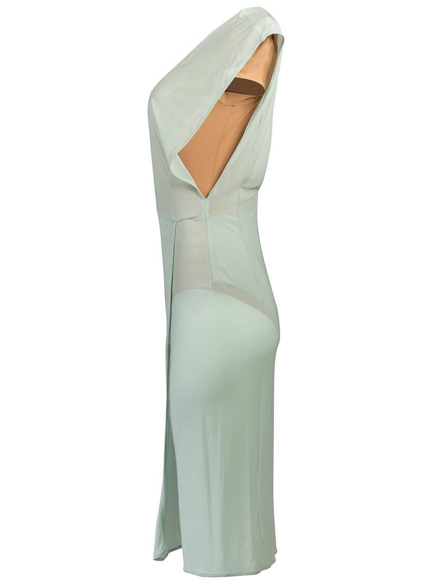 Maison Martin Margiela sheer sea foam dress featuring a deep v-neck and back, cap sleeves, and a layered front hem with a slit. Has a nude unitard underlay with a deep v-neck and shoulder pads. 2009 Runway Collection
