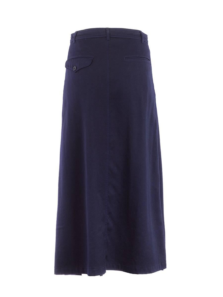 20th Century NWT Comme Des Garçons navy woven maxi skirt with an asymmetric panel and two slanted flap pockets in front, one flap and one slit pocket in back and a zip and button closure.