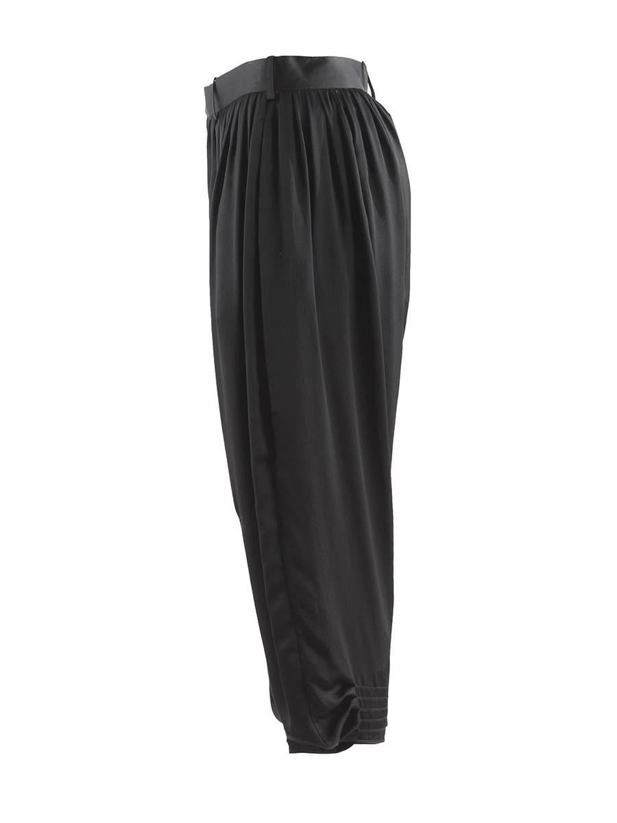 Undercover black pleated silk drop-crotch harem pants with belt loops, side pockets and intricate pleat detailing at the ankles. From the 2009 Collection. NWT.