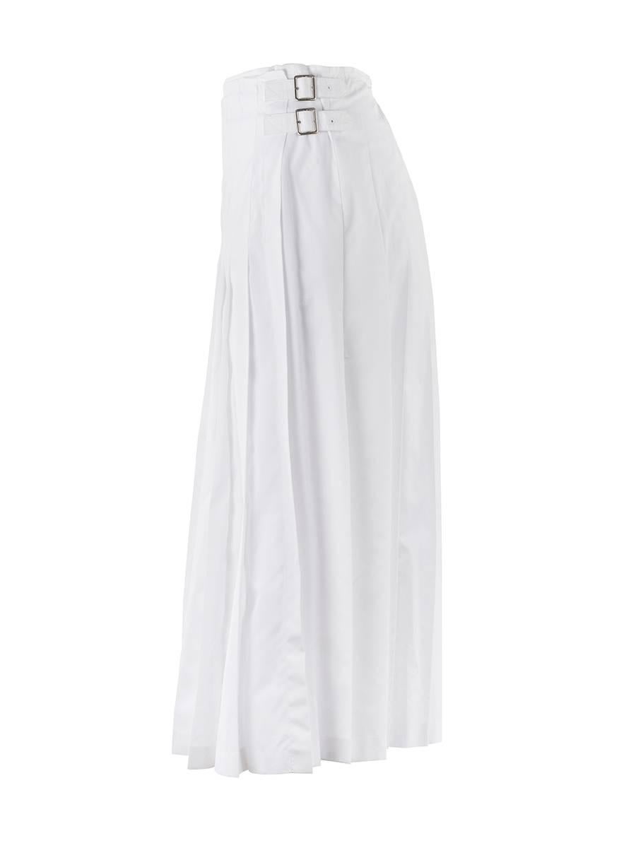 TAO by COMME DES GARÇONS White wool crepe pleated midi wrap skirt with double silver buckle hardware at the waist and minimal raw edge detailing from the Spring Summer 2007 Collection. NWT.