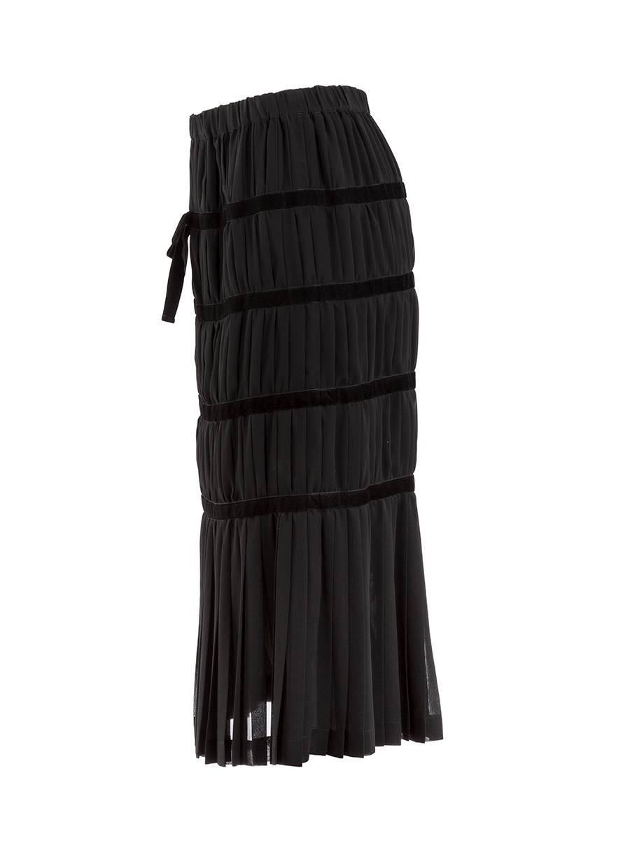 Black silk pleated midi skirt with an elastic waist featuring black velvet banding from 1990's Comme des Garçons. New with Tag.