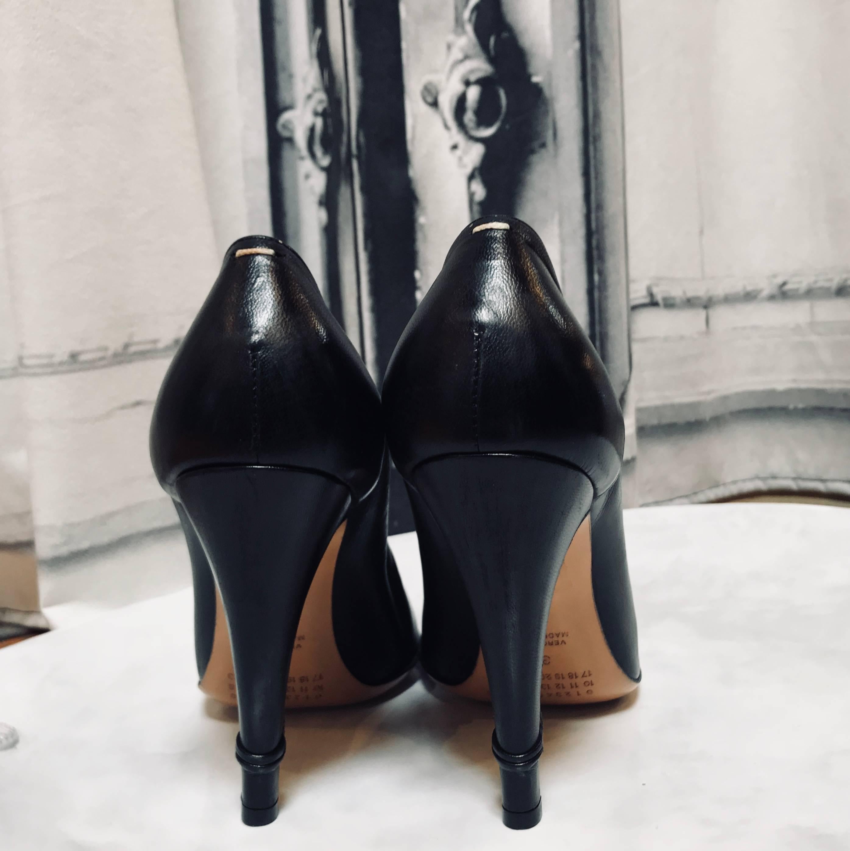 2005 Maison Martin Margiela 'After Party Pumps' New in Box. Destroyed look, as after a long night of partying. Curled up leather on the inside of the heels
Detached elastic straps on the right outer foot and front of the left foot. Shaved leather