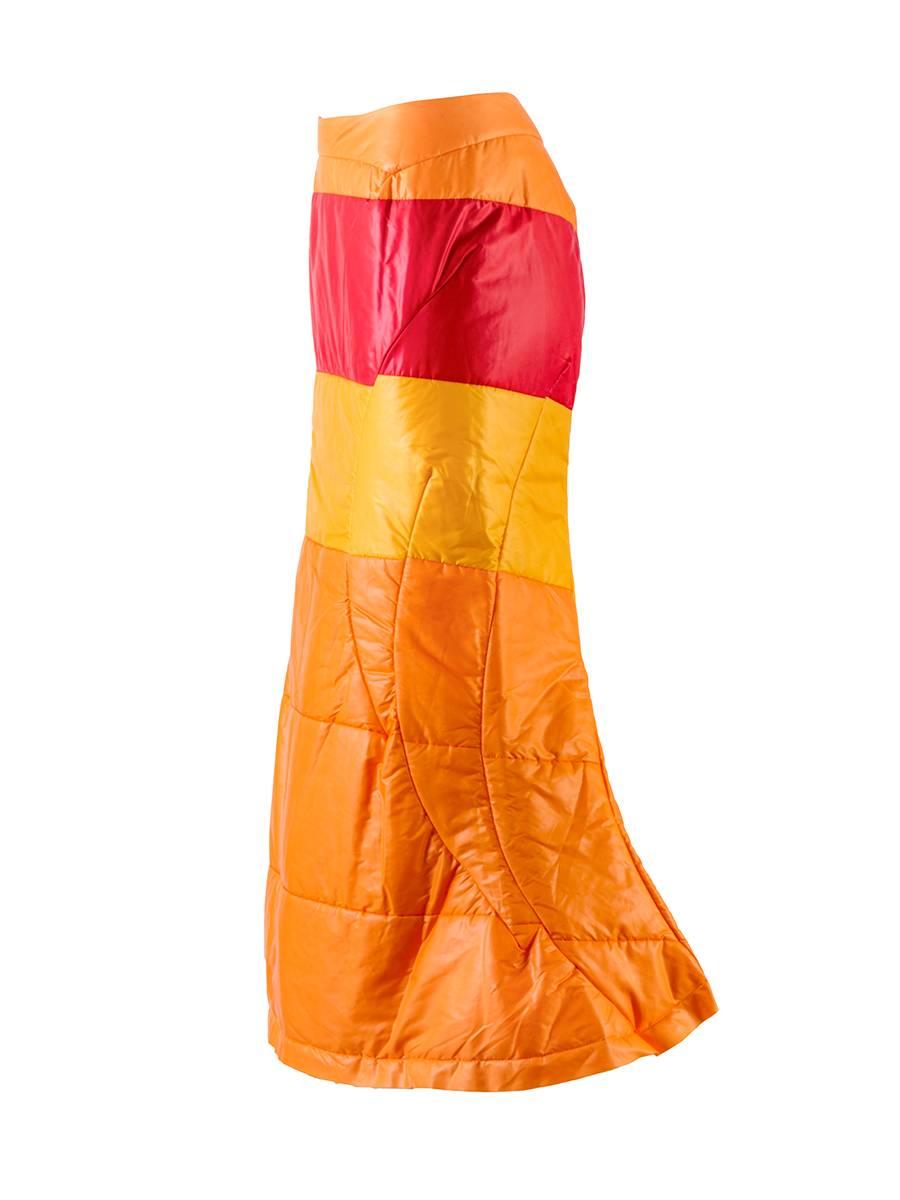 Orange, Red and Yellow Color Block Nylon Puffy Fishtail Skirt from Junya Watanabe Comme des Garçons featuring a fitted silhouette and invisible zipper at the waist from the 2004 Runway Collection.