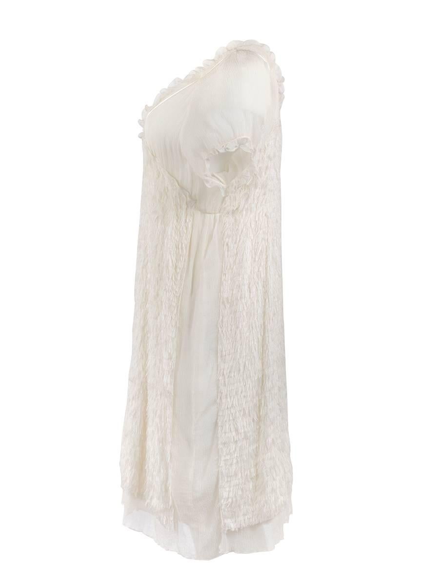 Undercover white sheer chiffon feathered babydoll dress with ruffled cap sleeves and sheer sides from the now iconic 2009 'Grace' Collection. New with Tag.